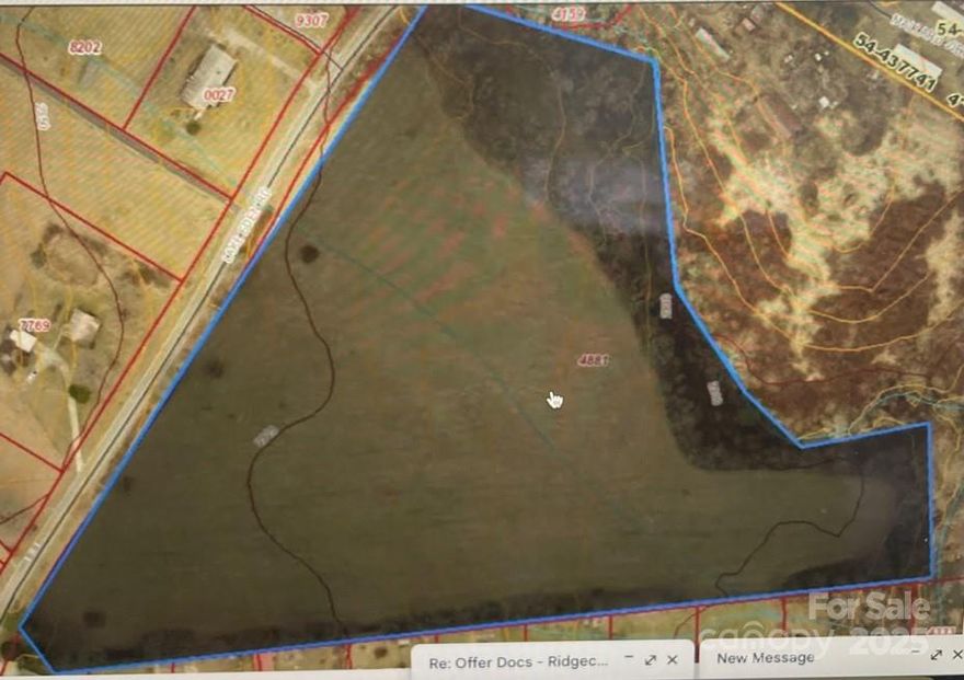 Approximately 13 acres of the larger property, the southern most hay field.