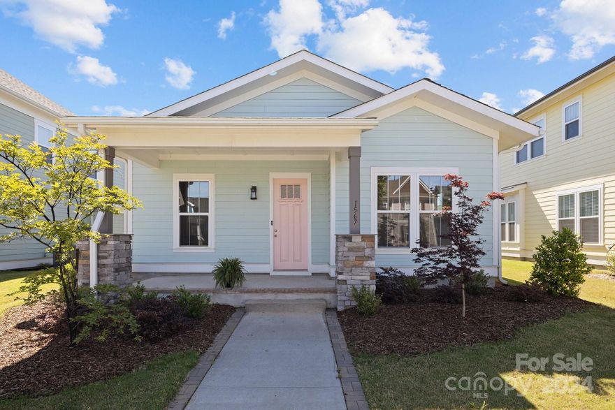 This is the charming bungalow plan you've been waiting on in sought after Riverwalk. This light- filled spacious  floor plan  features a chef's dream kitchen with an extra large kitchen island, large dining area, primary suite with spacious closet and spa-like bath. This home is ideal for entertaining due to its open concept and large spaces.   Enjoy the covered porch with your morning coffee or afternoon beverage. You will also appreciate the detached garage, offering ample storage space and convenience. Inside, discover three cozy bedrooms and two baths, providing comfort and functionality for one-level daily living. The neighborhood offers many amenities, including a large pool, lazy river, clubhouse, playground, retail shops, restaurants, and shared City of Rock Hill biking amenities. With its inviting ambiance and thoughtful design, this home is sure to fulfill your every desire for a cozy home in Riverwalk.