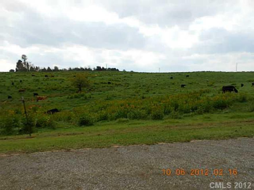 400+ ft. of Road Frontage, 9 Acres with pond & pasture. Peaceful country setting.