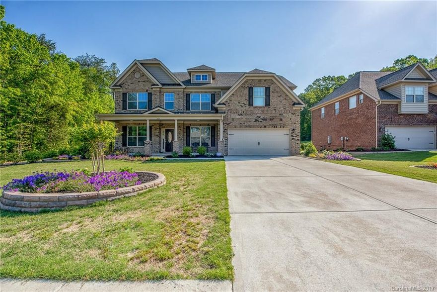 Highly upgraded Luxury Full Brick home in Fort Mill. Easy access to Ballantyne & Baxter area. Beautiful Architectural details with High-End Finishes.  Open Floor Plan, Gleaming 5" HW Floors in most of the Home, Granite Counter Tops, SS Appliances, Large MasterBR, Large Bonus/Theater Room, Large Covered Porch in Front, Large Fenced BackYard with Extra-Ordinary Landscape.  This Home is a pleasure to eyes, with Coffered/Trey/Vaulted Ceilings, Moldings, Landscaping, Scenic Views in the Backyard.