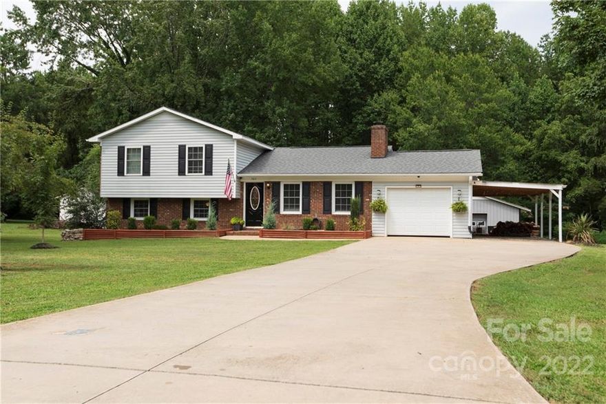 Split-level Mania! How do you get a lot of sqft in a smaller footprint? THIS is how. Well-maintained charmer with updates in the established neighborhood of Green Meadows. Upper level has 3 perfectly sized beds and 2 baths, main level has a cozy, open living room/dining area with fireplace, lower living area has it's own outside entrance, engineered flooring, a fantastic home office, full bath and laundry room. Attached single garage is currently functioning as a flex room, perfect for your man cave/she shed, workout space or for traditional use. Gorgeous low maintenance brick/vinyl exterior with rock/rock accents, fantastic landscaping and beautiful flower beds for a groomed look year round. More? Situated on a large .6 acre lot with all the space you need for any outdoor living ideas, a productive garden in place, above ground pool AND a massive 25X25 shop with power for all your DIY projects, hobbies, wood working or whatever you need it for! SO MUCH to offer! Welcome Home!