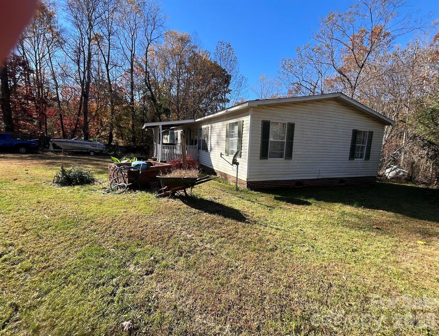 This home is situated on .55 acres and close to Love Valley , the Cowboy Capital of the East. Property offers affordability and a slate to create space of your choice. This 3 bedroom 2 bath home comes with a working fireplace, remodeled bath, fenced in yard complete with a solar powered gate. Architectural shingled roof was completed last year. Unfinished and unheated space offers a palette to create a workshop, office or any extra space you envision. There is a structure in the back suitable for hay storage and shelter for a horse.
