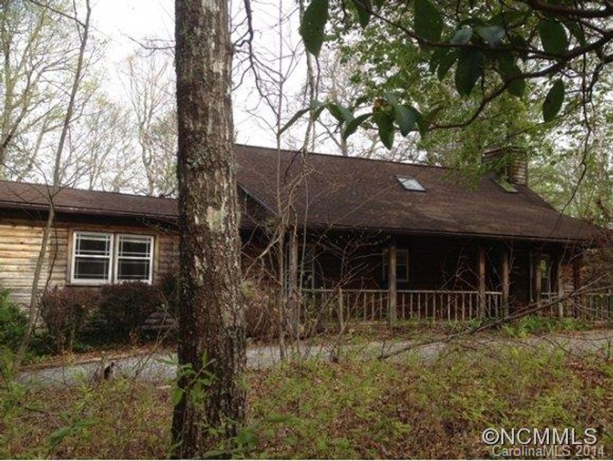 2 bed/3 bath cabin in picturesque wooded setting in Indian Lake Estates. Enjoy the tranquil wooded setting from either the covered front or rear decks. Other features of the home include an open floorplan, living room w/ cathedral ceilings and stone fireplace, 2 master suites, and full basement. Ready for new owners to update and make their own!Seller/Agent make no representations. MLS info not guaranteed. Please review attached offer instructs.