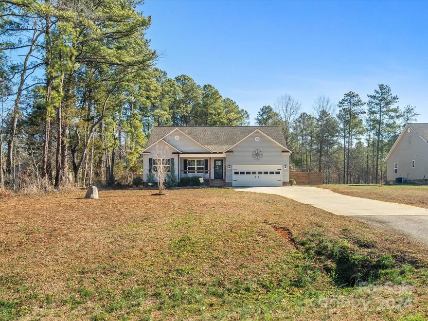 Located on just over an acre with fenced backyard in the country! The back porch is covered and leads to the deck surrounding the above ground pool which makes for a perfect place to lounge in the summers and cool off! Just off the front door is an entry hall with shiplap trim and hooks for your guests coats! The living room is open to the dining area and then to the kitchen. Stainless appliances and beautiful granite add a light touch to the gorgeous darker cabinets! Split bedroom plan allows for primary sleeping away from the guest bedrooms and bath. Laundry room located near primary at garage entry to home. Chambers Rd is a quiet stretch not 2 miles from shopping and dining and 15-20 minutes to I-77. County taxes with no HOA!
