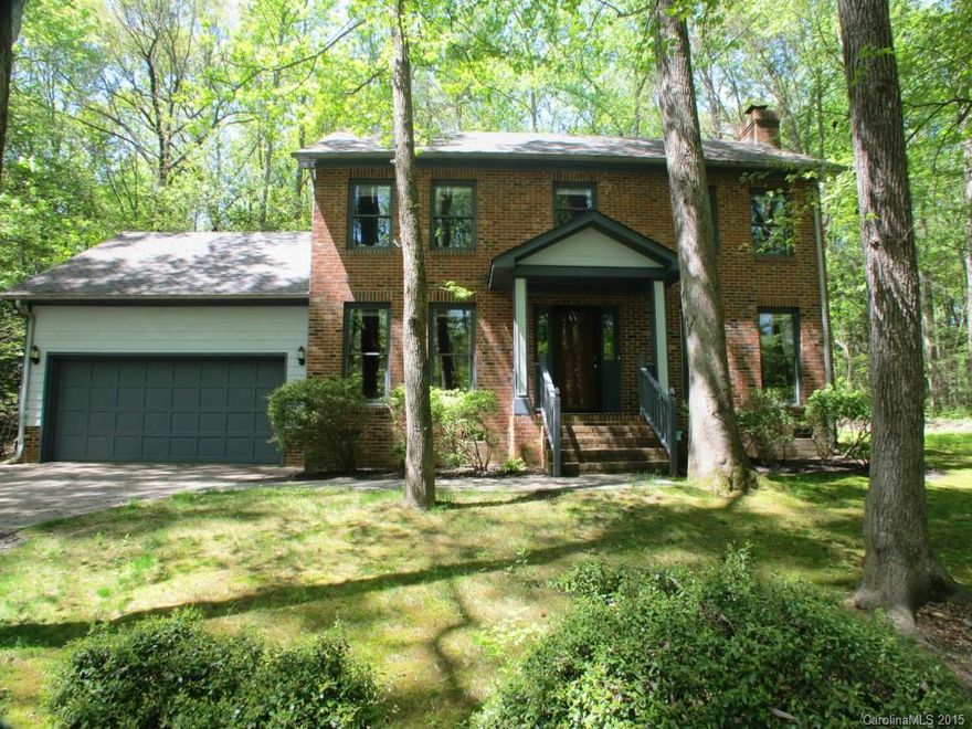 Two story custom built home on over 1 acre wooded lot.  Featuring new carpet, new refinished kitchen with granite counter tops and new dishwasher, breafast area with gorgeous forest view, new tile and vanity in upstairs bath, Jack & Jill bath between 2 spacious bedrooms, master bath has separate tub and shower, newly painted, wood deck.