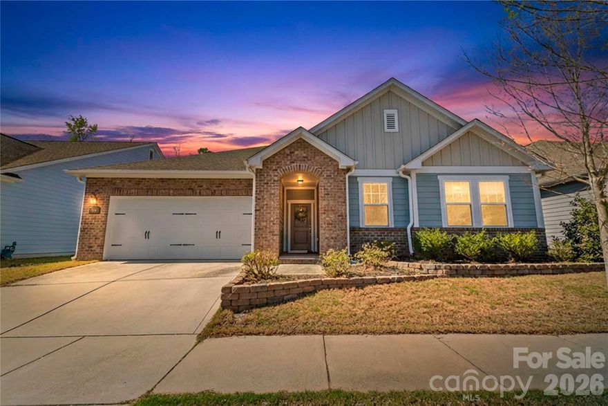 Welcome to easy, elegant living in the highly sought-after Massey community! This stunning, 2017-built ranch by David Weekley Homes offers the perfect blend of modern comfort and effortless style. The open-concept floor plan features a spacious living area that flows seamlessly into a chef-inspired kitchen, complete with a large island, breakfast bar, and ample cabinetry—perfect for entertaining. Retreat to the primary suite on the main level, boasting a trey ceiling and a private layout. Two additional well-appointed bedrooms and a second full bath provide plenty of space for guests or a home office. Step outside to your private oasis: a fenced, wooded backyard featuring a covered rear porch and an extended patio with a pergola—ideal for morning coffee or evening relaxation. With high-end finishes like tile and vinyl flooring (no carpet!), insulated windows, and a permanent stairs-to-attic storage solution, this home is as functional as it is beautiful. Enjoy Massey’s world-class amenities and award-winning Fort Mill schools (Doby’s Bridge Elementary, Forest Creek Middle, and Catawba Ridge High). Experience single-story living at its finest—schedule your showing today!