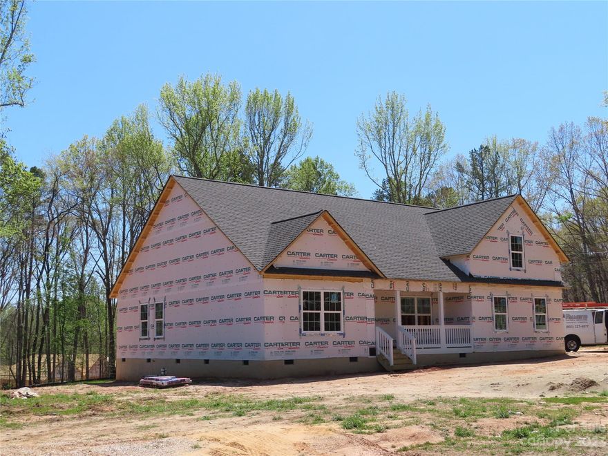 Welcome Home! Come and see this new construction home with a side load garage sitting on one acre of land. This farmhouse style home has a front and back porch and sits on a corner lot. A formal dining room as well as a breakfast area is included. The house will have LVP flooring throughout except the bonus room will have carpet. This home also has a split bedroom plan, granite counter tops and a fireplace.  House should be complete the end of May.