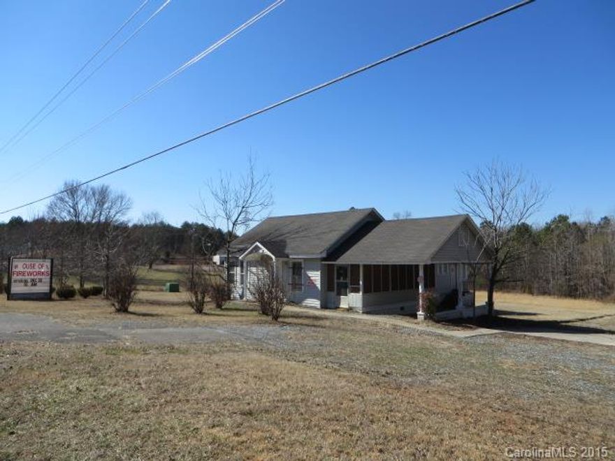 Property can be bought as a Fireworks Business, inventory is negotiable. The 5 acres zoned UD could be used with other business like car lot or mobile home sales center to go with fireworks business. Building has 5/7 rooms some used as storage, (house sold as is) lots of parking. 290 ft road frontage, Property has a well but water & sewer is  available at street. Great location 1/2 mile from the NC state line.