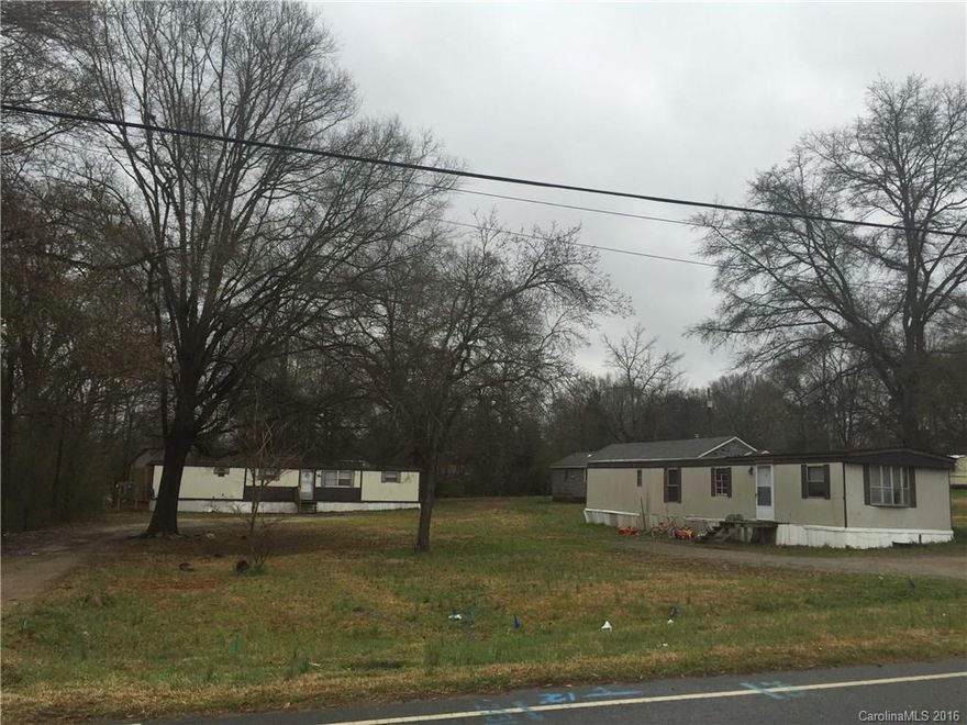 Investors take note! Positive cash flow. 2.43 acres with 8 rentals. 6 mobile homes with renters. One single family with a tenant. Main building out front could be rented. Over $30,000 year income. Priced to sell.