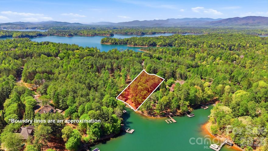 Long-range water views and a fully equipped dock setup make this waterfront lot in SouthPointe stand out. Located at 4981 Camellia Drive (Lot 228), the property overlooks a quiet, protected cove with a view that opens up beautifully across Lake James. A platform dock, floating dock, and jet ski ramp are already in place—offering immediate access to the water without the wait. The setting provides both visual appeal and calm conditions for swimming, paddling, and boating. SouthPointe is one of the most established communities on Lake James and the only one with public sewer, along with high-speed fiber internet. Amenities include a lakeside clubhouse, pool, and walking trails. Convenient to downtown Morganton, where you’ll find a growing selection of restaurants, breweries, shops, and daily essentials. Well-positioned waterfront lots with this combination of view, dock, and build-readiness are becoming increasingly limited on Lake James.