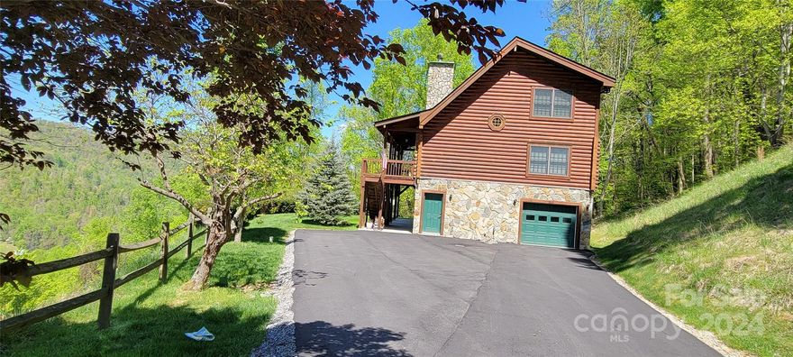 A true D-log home w/wood beams, wrap around porch/deck built to enjoy the long-range mtn views at approximate 3000 ft elevation.  Convenient to downtown Waynesville, Maggie Valley & walking trail of beautiful Lake Junaluska.  Interior includes 2 Br with sleeping loft, 3 bath, family room, laundry room, rock faced FP, T&G vaulted ceilings, wood & ceramic floors, open wood steps w/round wood banister railing and 15x40 foot tandem garage/workspace.  Amenities include MVSD water, MV sewer, UG electric, street lights, split rail fencing, paved driveway. Paving of main road past driveway to be completed soon per Seller.  Home being sold furnished.  Property [now Lot 29 - Subd of Bodis Inc per deed] currently is not part of Linson Ridge HOA per Seller/Town officials.  Short Term Rentals allowed. Seller will listen to offer including seller's adjacent 12.8 acs, if buyer desires.