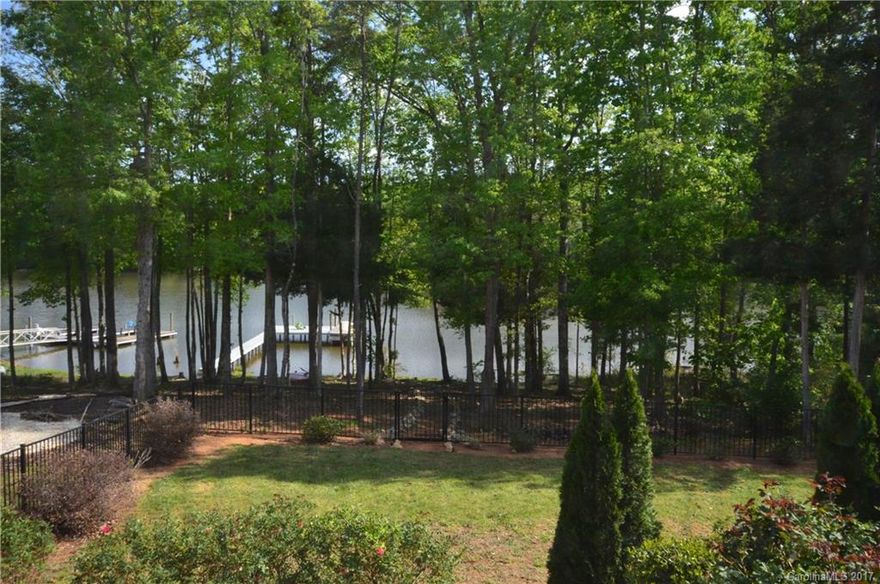 Live every day like a vacation!  This wonderful lakefront home has barely been used. It is in move-in condition. The views from the great room, master bedroom, and the backyard are fantastic.  This home has an open floorplan with a huge cathedral ceiling. The great room, kitchen, and dining rooms are open and are perfect for entertaining.  The master is a great size with a walk in closet and a huge shower.  There is a screened in patio, an open patio and a lighted path that leads to the water.