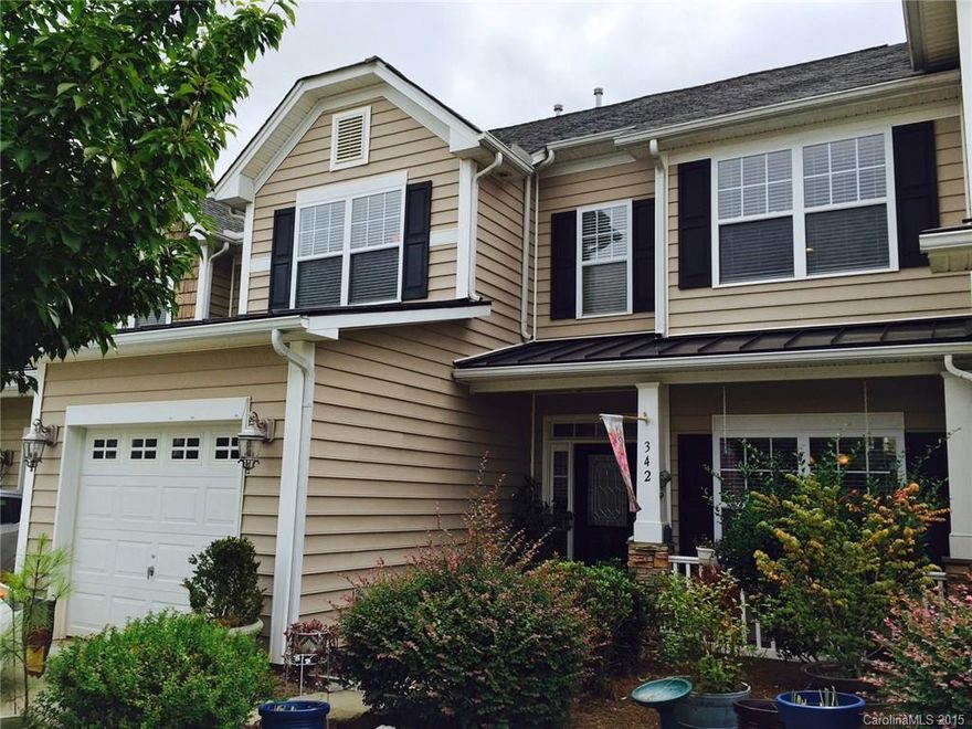 Welcome home! This FRESHLY PAINTED  townhome is centrally located to shops, restaurants, hospital and much more. Master bedroom and laundry are both on the main level. Living room comes with a gas fireplace and is pre-wired for surround sound. Kitchen has granite counter tops along with stainless steel appliances. Neighborhood has splash pool, playground and athletic field.