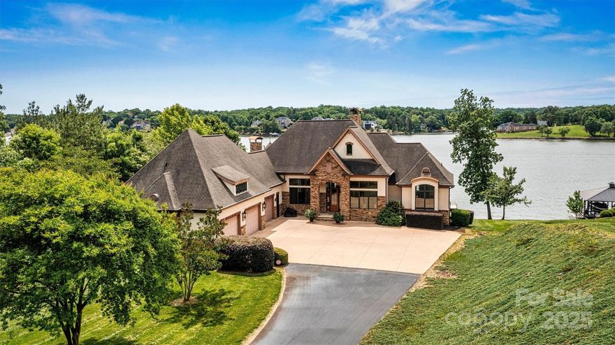 Premier lakefront property in gated Plantation Pointe on almost two acres, offering stunning, long-range views of Lake Hickory. This custom-built home has been meticulously maintained and is ready for you to move in and start enjoying the lake life. Designed for both comfort and convenience, this property boasts a range of desirable features. Effortlessly launch your boat from your private boat lift, and enjoy easy access to the water whenever the mood strikes.  While spending time waterside you will notice the extensive  composite sea wall which should never need replacement.  Extensive storage throughout the home ensures plenty of space for all your belongings. Comprehensive security system with multiple cameras. The beautifully landscaped property is kept vibrant and healthy with a 9-zone irrigation system, minimizing maintenance. The property also offers a 3 car garage that is over 1500 square feet. Property is well out of the flood zone and had no hurricane damage.