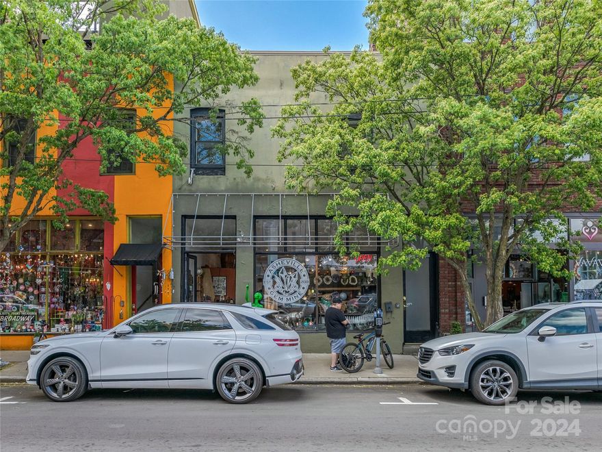 In the heart of Downtown Asheville mixed-use building with excellent foot traffic and CPD. Excellent opportunity for an owner user or investment property with value-add potential throughout. Street level retail space with tenant in place until 2025. All other spaces are leased on a month to month basis. Upper level residential, currently used as an income producing rental, wood floors, high ceilings and open floor plan are conducive to renovation as a primary residence or a downtown rental. Building also includes lower level basement area with access from Carolina Ave (currently rented month to month for storage). Three parking spaces behind the building are also currently rented month to month. It's a great building as-is with a ton of potential. Spaces are occupied, so please do not disturb tenants. Check out the virtual tour to learn more about the space. Please contact the listing broker for more details.