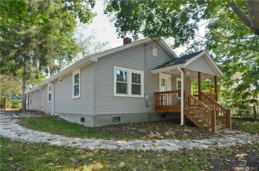 Conveniently located, move-in ready home features open floor plan, two master suites, and covered porches front & back. Enjoy long-range views of mountains, downtown Asheville, and the Grove Park Inn from fire pit area in private back yard. New HVAC, roof, and siding in 2015. Updated plumbing/electric. Sellers are willing to convey some or all furnishings with an acceptable offer, if the buyer is interested. 5 miles to downtown & 2 miles to the heart of West Asheville.