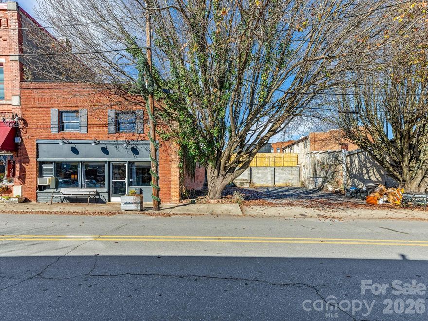 An exceptional opportunity in the heart of Downtown Black Mountain’s Historic District, 204 Sutton Avenue offers a rare chance to create a truly unique residential vision. This property includes a versatile existing structure plus an adjoining open lot, all with prominent street frontage in one of the most sought-after locations in town.
The building provides a flexible framework for redevelopment, allowing for the creation of a distinctive single-family residence, multi-family living, or a potential condo project—subject to buyer verification of zoning and approvals. Loft-style interior space offers character and adaptability, while a private upper level provides an excellent foundation for additional living areas, guest suites, studio space, or separate quarters.
Additional highlights include private parking, excellent visibility, easy access, and unmatched walkability to shops, dining, parks, and events that define downtown Black Mountain living. For those seeking a rare blank-slate property in an exceptional location, this offering offers limitless residential potential in one of Western North Carolina’s most desirable markets. Seller is a licensed North Carolina Realtor.