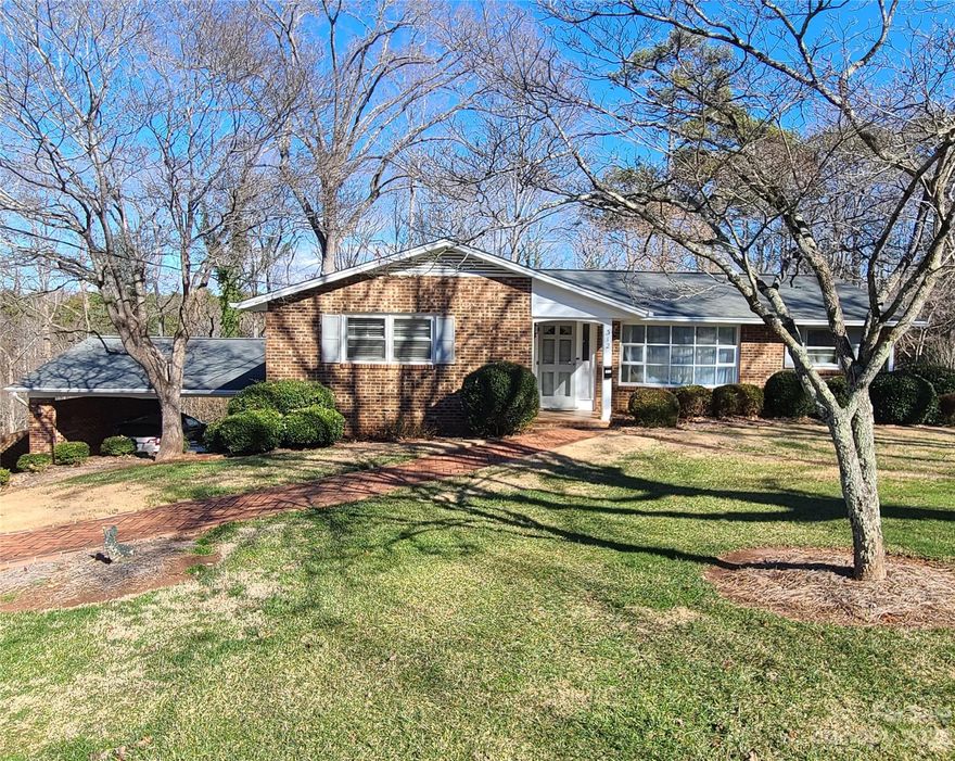 Back on market through no fault of the seller!! Charming 3 Bedroom, 3 Full Bath Home with Basement Den and Sunroom! The living room features a lovely bay window. The eating area in the big kitchen has a fireplace and access to the spacious sunroom. Off the sunroom is a roomy deck overlooking a great backyard. One of the highlights of this home is the basement den—a versatile space that can be transformed into a home office, entertainment room, or your personal sanctuary. Imagine the possibilities! The real showstopper is the big sunroom that overlooks the expansive backyard. Flooded with natural light, this sunroom is the perfect spot to enjoy your morning coffee or unwind with a good book. The backyard offers plenty of room for gardening, play, or outdoor gatherings. Additional features include a dedicated laundry area, ample storage space, and a two-car carport. Great NW Hickory location!
