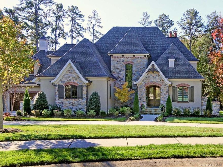 Beautiful waterfront home located on a quiet cul de sac in The Point. Modern French Country, custom built by Kingswood,  this home is beyond impressive.  A versatile living space that is perfect for any size family with Two Master suites (one up and one down).  The chefs kitchen is a dream with all top notch appliances. Fantastic wrap around stone terrace is prime for alfresco dining and entertaining.