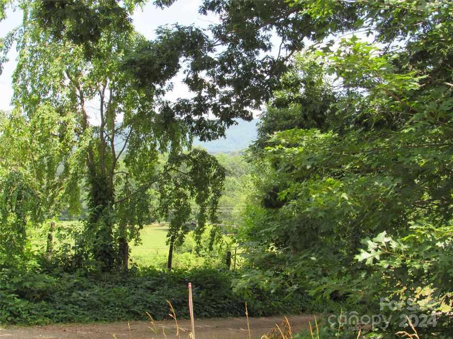 Desirable Location off Lake Eden Rd. Beautiful View all around. This .66 acre lot is mostly wooded but with young tree growth. Gently sloping with southerly views. There will be some restrictions put on the property such as no manufactured homes, minimum square footage, and no livestock. Just minutes from Camp Rockmont, Mountain Home Thrift Store, Owen High Shool and minutes to I-40, downtown Black Mountain or Swannanoa. A portion of Pin #9699-87-3773.