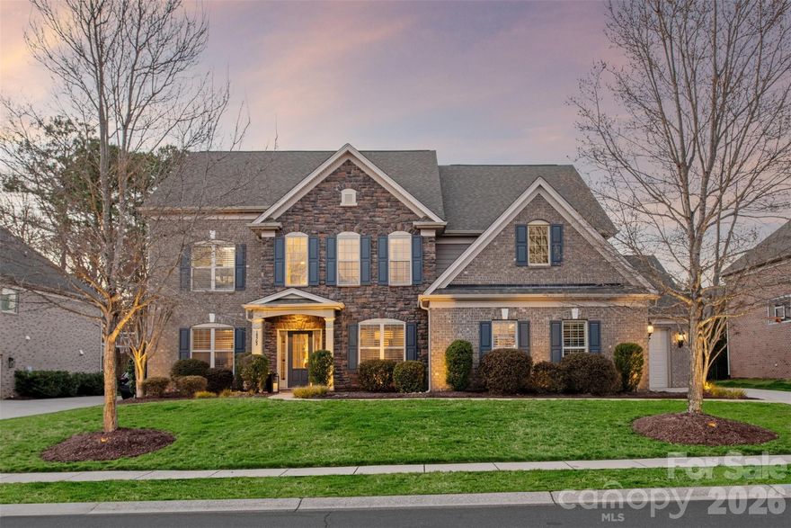 Showings Begin Friday 4/17. Interior photos coming!  Coveted Avalon floorplan in one of Ballantyne’s most desirable locations! This beautifully maintained home offers 6 bedrooms and 5 full baths with a layout designed for comfortable living and effortless entertaining.

The open-concept main level features a renovated kitchen with gorgeous granite countertops, a large center island, and abundant cabinetry. The kitchen flows seamlessly into the breakfast area and family room, creating an inviting space for gatherings, while direct access to the back patio makes indoor-outdoor entertaining effortless. A main-level guest suite with a renovated bath provides ideal accommodations for visitors or multi-generational living.

Upstairs, the expansive primary suite offers a peaceful retreat with a cozy sitting area. Secondary bedrooms are generously sized, and the versatile third-floor bedroom/bonus room with full bath provides flexible space for guests, recreation, or a private office.

Step outside to a truly exceptional backyard retreat—fully fenced and private with an expansive lawn. The showstopping covered pavilion features a stunning stone fireplace, built-in grill, and bar seating, creating the ultimate outdoor living space for year-round entertaining.

Located just minutes from Ballantyne’s premier shopping, dining, and recreation and served by top-rated schools, this home combines a highly sought-after floorplan with an unbeatable location.
