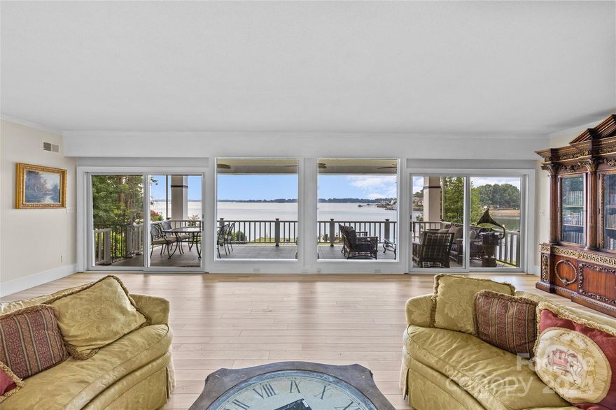 "Wow" will be the first thing you think as you walk around the corner from the entry way of this home.  The large picture windows that span the back of this home provide for some of the most breath taking views on Lake Norman.  The inviting back deck is the centerpiece for the vast open water landscape this home offers.  Sunrise from the back porch and sunsets down on the large dock w/sailboat slip jet ski launch and boat lift.  The back yard has a rare and hard to find all brick boat house on the retaining wall of Lake Norman. The flat back yard and grandfathered boat house is ready to be retrofitted into the perfect outdoor oasis.  Plenty of room for the pool of your dreams.  This 5 Bedroom 3&1/2 bath home is a must see.