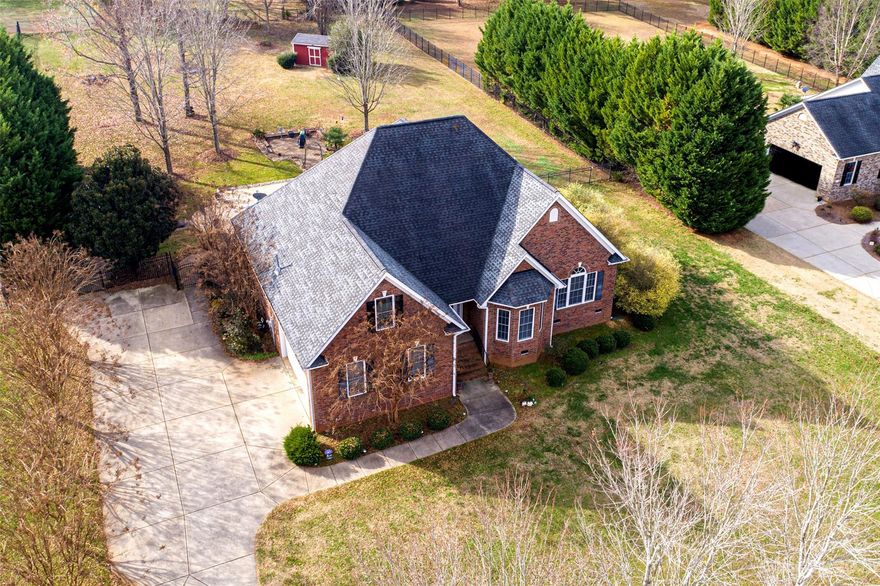 Welcome to this charming full brick home located on a cul-de-sac in the desirable Homewood neighborhood! Inside you will find a well designed layout that offers both functionality and comfort. This spacious home is filled with natural light, gleaming hardwood floors, crown molding throughout main level, and a gas fireplace, creating an inviting and welcoming atmosphere. The kitchen features stainless steel appliances, granite countertops, a convenient layout and ample storage space. The primary bedroom is located on the main level with a tray ceiling, ensuite with soaking tub and dual vanity. Two additional bedrooms on the main level, one with a vaulted ceiling and the other with a bay window allowing tons of natural light.  Upstairs you will find two sizable bedrooms and a loft/office/flex area. Step outside into your own private oasis perfect for relaxation or entertaining with a beautiful screened porch, inviting In-ground swimming pool and large, fully fenced back yard.