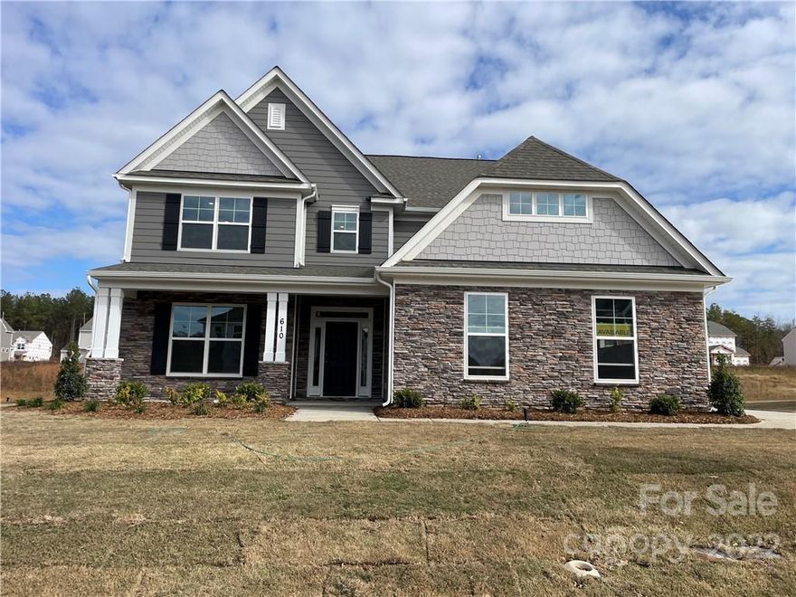 NEW construction in Waxhaw! This 3-story Hamilton plan has 6 bedrooms, 4.5 baths, and more than 3,900 square feet. The main level includes a guest bedroom and full bath, a study with French doors and a coffered ceiling, a designer kitchen with island and butler's pantry, a dining room with tray ceiling, and a family room with a gorgeous stone fireplace and a sunroom. Beautiful and durable Enhanced Vinyl Plank flooring runs throughout the main living spaces. The second floor includes the primary suite and three additional bedrooms and the third floor has a spacious bedroom and full bath. The kitchen has grey cabinets with soft-close doors & drawers, quartz counters, a tile backsplash, stainless appliances including a gas cooktop, a farmhouse sink, and a pot-filler over the cooktop. Enjoy the outdoors on the paver patio with firepit. Onsite New Home Specialist can provide guidance regarding estimated completion dates - however any dates provided are subject to change.