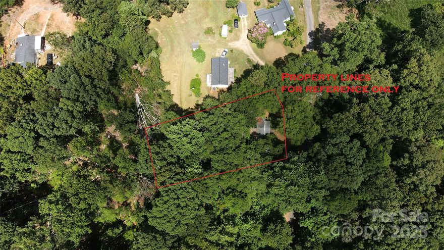 PRICED BELOW TAX VALUE.  Investor Opportunity on .46 Acres of Serenity.  Discover the potential of this stunning .46-acre lot dotted with majestic, mature trees. Nestled in a peaceful setting, this property offers a rare opportunity for new construction in a highly sought-after area. The existing home is considered a tear-down—bring your vision and build your dream residence from the ground up. With ample space and natural beauty, this lot sets the stage for a private retreat or stylish modern build. Property is being sold *as-is* and the value is in the land only. Let the landscape inspire your next project!