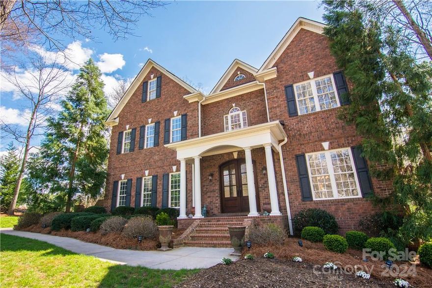 Elegant Highly Customized all Brick Home with Upgraded Upgrades! Not just hardwood floors, Brazilian Cherry Hardwood Floors. Not just Solid Wood interior Doors, 8 & 7 Foot Tall Solid Wood Interior Doors, not just a tiled foyer, a Travertine Tiled Foyer. And not just a staircase, a Grand Curved Staircase. And the list goes on. Located in Northern Cabarrus County with low taxes and a Davidson Address. Perfect Country setting in a small custom home neighborhood AND close to main roads, shopping and interstates. Just over an acre lot on a quiet Cul de Sac. Custom Gourmet Kitchen with solid Cherry Cabinets, Bosch 5 Burner Gas Cooktop with Downdraft Ventilation. On the second Floor is the Impressive Master Bedroom Suite (with a Private attached Office) and the 3 spare Bedrooms. On the third floor is the Media Room, a Bonus Room and a Full Bath. Beautifully landscaped 1 acre lot, Side Load Garage and a Relaxing Morning Porch off the 2 Story Great Room. Prestigious Luxury at an Amazing Price!