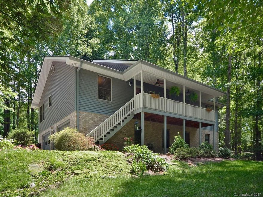 Truly a House Beautiful. "WOW FACTOR" kitchen/cabinetry/SS appl  will sell this house! Totally updated main Bas: Travertine tiled Mstr shower, Air bubble massage tub. HDWD/tile floors on main,new carpet in lower. Updated full lwr lvl BA. Arch roof 7/17.Trane Htpump-2011. Mstr w-in closets(2).Crown molding throughout.Perfectly positioned house for privacy ,cleared area for play, gardens w/walking paths. Covd front porch with fans: enjoy the treehouse effect. 900sqft of DBL garage & workshop space