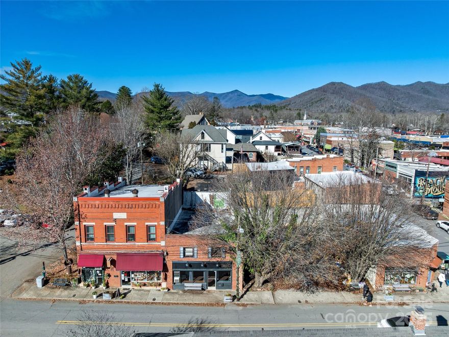 An exceptional opportunity awaits in the heart of Downtown Black Mountain’s Historic District. 204 Sutton Avenue offers a truly rare combination of a versatile building plus an adjoining open vacant lot, all with prominent street frontage. A hard-to-find feature in this coveted location. The property features a double entrance, including a loading dock, making it ideal for a wide range of commercial, creative, or mixed-use concepts. Inside, the loft-style layout provides character and flexibility. At the same time, the private upstairs space totaling over 900 square feet offers a separate, secluded area perfect for office use, studio space, or private workspace. Additional highlights include private parking, exceptional visibility, and unmatched walkability to shops, dining, and events that define downtown Black Mountain. Whether you’re an investor, entrepreneur, or visionary owner/user, this property presents limitless potential in one of Western North Carolina’s most desirable markets. SELLER IS A LICENSED NC REALTOR