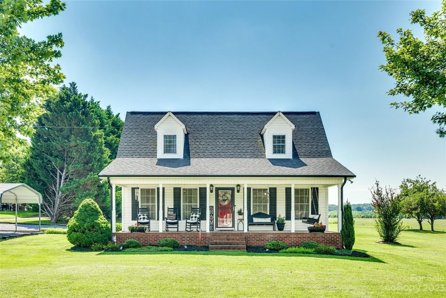 GORGEOUS desirable, flexible floor plan with neutral finishes! Front porch is perfect for rocking chairs and conversation. Spacious living room with red oak wood floors. Updated kitchen with breakfast nook, yards of quartz countertops, upgraded appliance package, and beautiful wooden cabinets. Pantry and Utility room just off of kitchen for great storage options. Owner's suite on main floor complete with two closets and an ensuite bathroom. Two bedrooms upstairs with hall bathroom. Walk in attic space is great for storage. Back screened patio off of the kitchen area has beautiful hardwood floors, recessed lights, and is an added entertainment space. Bonuses are tractor shed that is wired for electric, firepit that conveys, and a gravel driveway with a carport.