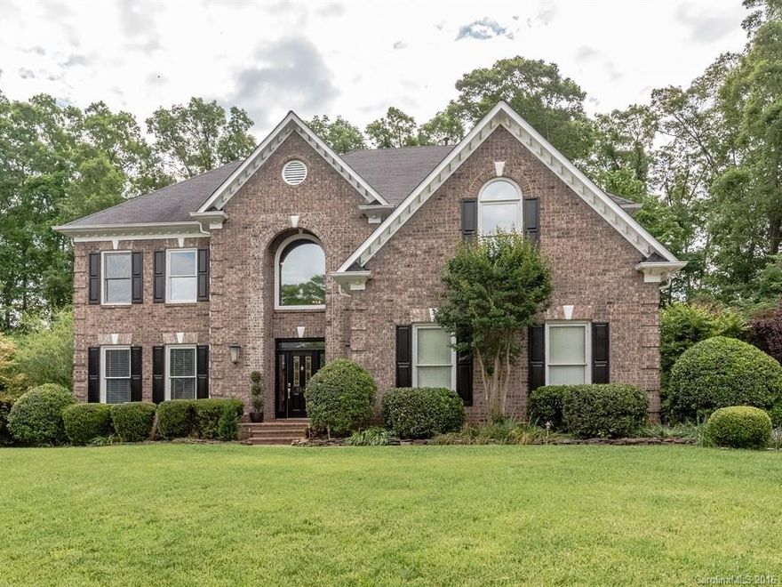 Exquisitely Remodeled Ballantyne area brick beauty on a private lot with pond, large deck & patio. Features new hardware, fans, seamless shower, commodes, flooring, paint, refinished cabinetry, faucets & more!  Viking Gas Island Cook top, new dishwasher, granite counter tops, hardwoods, dual staircases, over sized master suite with closet organizer, corner Jacuzzi tub, large bonus room, & 3 other bedrooms on the same level. Prime location is around the corner from retail, dining, & nightlife.