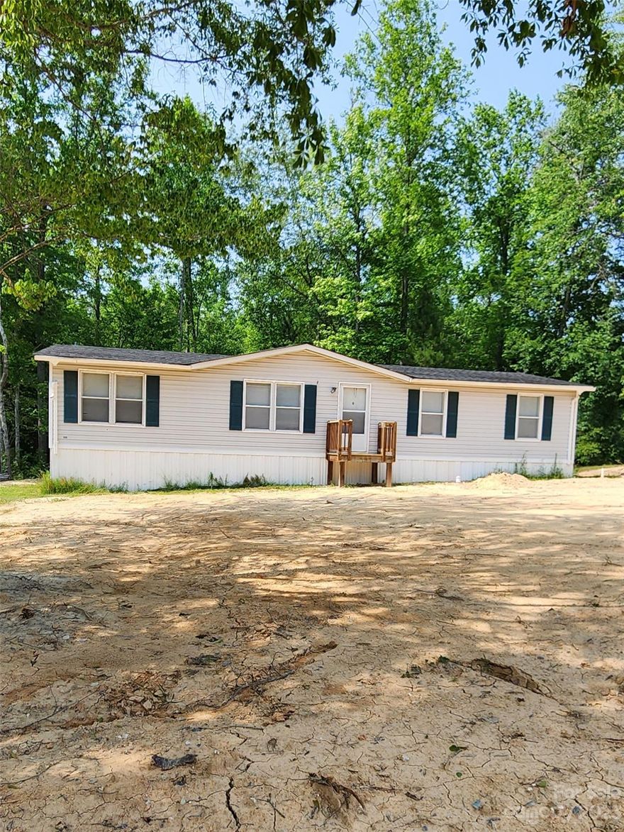 4 bedroom 2 full bath home on almost a half acre. Seller was in process of rehab when he decided to sell. All rough-in inspections have been completed and cleared (building, electrical, mobile home, hvac, plumbing, sewer and water lines). Driveway will be 10ft wider at the road and water line ditch will be filled in. Seller intends to make no repairs beyond those. Water is on for now. Power is not. Permits are pulled for everything except HVAC, which will require HVAC Certified Contractor to install (per County info). Permits are in Sellers name but available for someone to complete necessary work. County Water, Septic System installed! Everything is electric. Seller has been offered $1,400 rent once he finished so that is an expected rate for a rental portfolio. This place is a diamond in the rough. Huge potential with most of the heavy work done. Contact a Buyer Agent for additional details. A Buyer Agent must accompany showings. Tax record is NOT accurate. Recent Survey available.