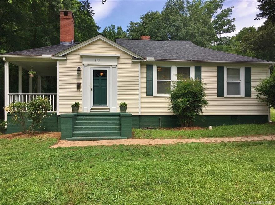 Own a home steeped in Fort Mill history! Adorable bungalow in the heart of Fort Mill originally built for one of the Springs plant managers. Original transoms, fireplace & mantel are examples of the quality that went into this home. Situated on large wooded lot. Original maple wood flooring beneath carpeted bedrooms. Generous porch located on side of home. Architectural shingles (2011) cover roof over huge attic that offers extra storage. No HOA and exceptional schools!