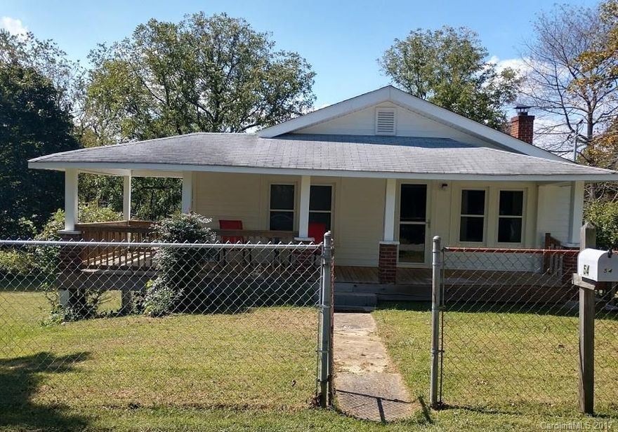 Wonderful opportunity for first time home owners or investors. Zoned as C-S, you have plenty of options with this property.  This 1940's bungalow has 2 BR 1 BA and is located on .65 acres.  Updated kitchen and laminate wood floors this home has a lot of potential.  Conveniently located between Asheville and Weaverville and UNCA.