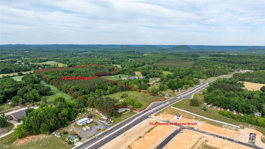 ATTENTION DEVELOPERS & INVESTORS — PRIME OPPORTUNITY!
Family-held farm now offered for sale! Ideal for residential development with annexation approval from the City of Albemarle. Across from Morrow Brook, a new True Homes subdivision now under construction.

42.14± acres across 3 parcels, sold together.

435± feet frontage on East Main St (NC Hwy 24/27/73).

1.77± acres city-zoned R-8 Residential.

40.37± acres county-zoned: 3.9± acres General Business, remainder R-A Residential Agriculture.

11.5± acres of 20+ year pines for immediate equity.

1012± feet paved frontage on Sweet Home Church Rd.

Albemarle and Stanly County are growing rapidly — seize this affordable development opportunity. MUST SEE — ACT NOW!