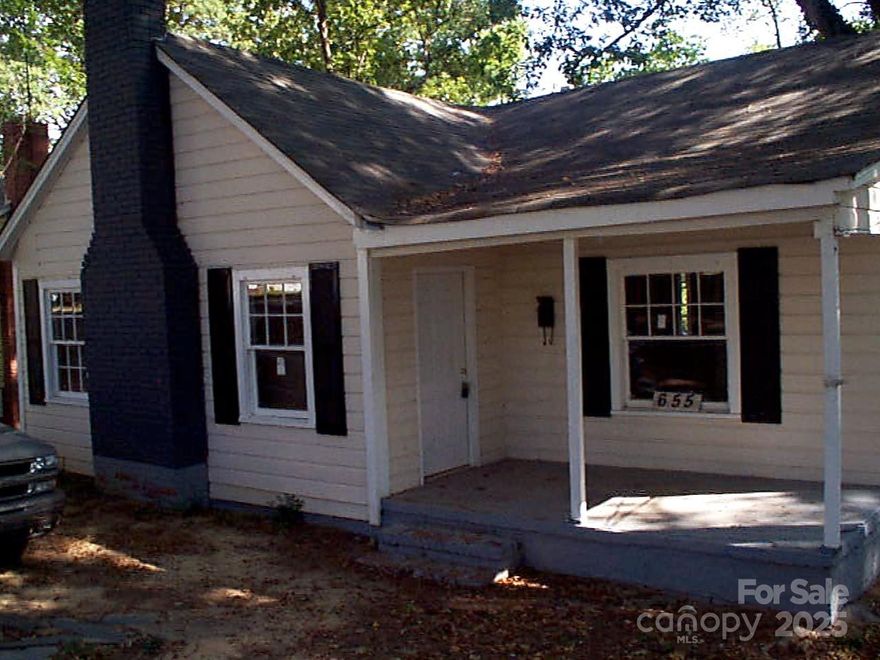 Charming three-bedroom home featuring one full bathroom and one half bathroom with a functional, traditional floor plan. The welcoming living room showcases a wood-burning fireplace, creating a warm and cozy gathering space, while the dining flows seamlessly into the kitchen for comfortable day-to-day living. An exterior entrance provides access to an unfinished basement—perfect for storage or future expansion—and the recently installed water heater provides added peace of mind. An excellent opportunity for investors or buyers seeking a solid rental property.