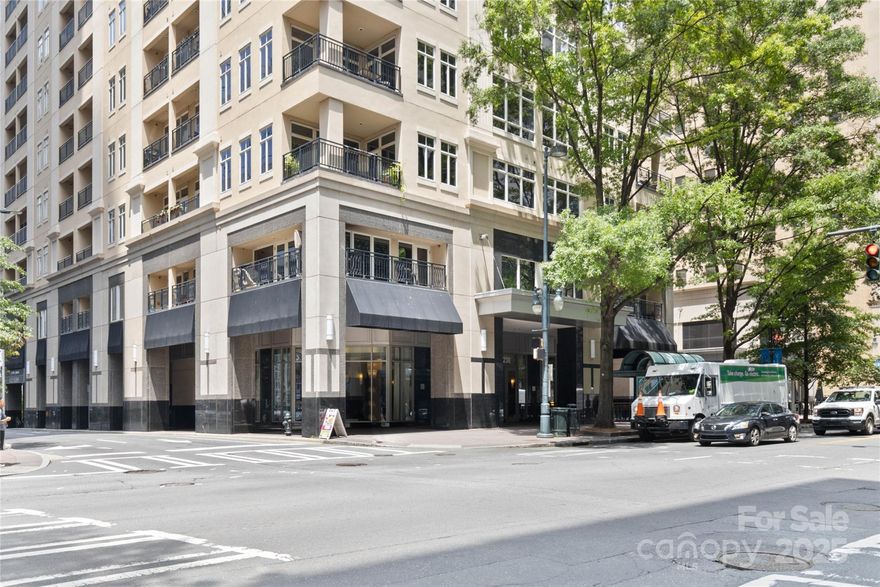 PRICED TO SELL! Iconic building in the heart of center city! This bldg feels like a luxury, upscale hotel with a NYC 5th Ave vibe!  A block south of the "square", this prime location is walking distance to Truist Field, BOA Stadium & Romare Bearden! Walk out of your building & within a few feet you can be at upscale restaurants, watering holes & shopping! Don't let the square footage throw you off. With 10' ceilings & floor to ceiling windows, this high-end studio feels extremely spacious. Features include quartz counters, updated bathroom, stainless appliances, new flooring, built in office nook & ample storage. Fresh, neutral paint. Secure building features a dedicated concierge, grand lobby with seating both inside & out, a newly constructed resident gathering area features dynamic city views, a huge bar, big screen tv's & pool table. Additionally, you'll find a resort style outdoor pool & 24-hour fitness center. With only 114 units, this is a rare find in an exceptional building!