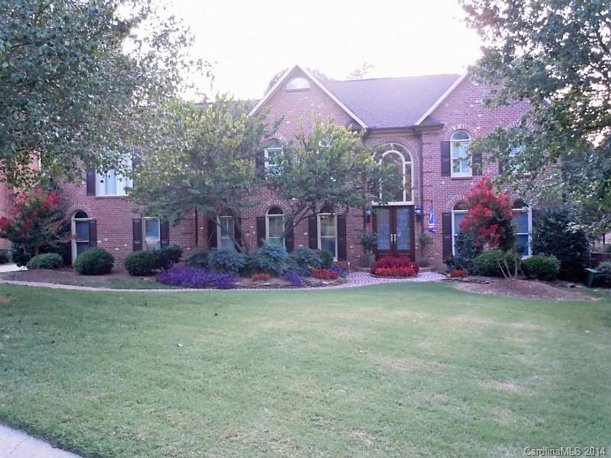 Fabulous 2 sty w/full finished basement w/ bedroom & full bath, media room,2nd LR w/FP, wet bar w/ private entrance. On main winding stairs, Hrd Wds thruout main level, kit w/42' Cherry cabinets, granite, SS appl, dbl ovens, 5 burner gas cooktop/custom tile b'splash,dsk area Main level also features 1 bedroom. Upper lvl features spacious master & luxury bath, additional bedrooms have jack and jill bath. Screen Porch and deck of main area, Lrg patio off basement LR. Private wooded yd/brick fence.