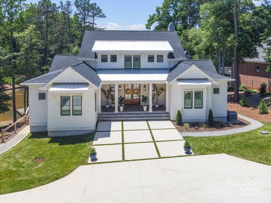 Tucked away on the peaceful shores of Lake Norman, this home is the perfect escape for those who value freedom over formality. Outside the confines of restrictive HOAs, this property offers a relaxed, off-the-beaten-path lifestyle without sacrificing comfort or luxury. Inside you’ll find 4 spacious bedrooms, each with private ensuite, including a lavish main-level owner's suite and a guest suite. The chef's kitchen, equipped with top-of-the-line appliances, is a dream for any cook. Step outside to enjoy lake views from multi-level outdoor spaces, featuring a sparkling pool and spa. Every detail in this home exudes sophistication. Upstairs, 2 more bedrooms, a loft, and flex room await. A private boat dock with lift, separate entrance basement apartment, and 3-car detached garage complete the package. Plus, outdoor enthusiasts can enjoy McCrary Woods’ scenic 3.5-mile loop for walking, jogging, or biking. Luxury lakefront living at its best! See prop website for addl info and pics!