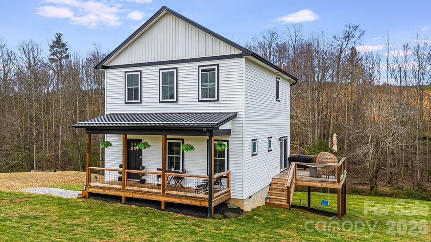 This like-new home, built in 2021, sits on a large lot in the pastoral beauty of the Alexander area. A small brook behind the house is enjoyable from the side porch, which is great for entertaining or grilling out. Across the creek is additional land with this property where you can watch whitetail deer and turkey as they are frequent visitors. The side porch as direct access off the dining/kitchen area for convenience. The front porch is covered and a nice space to relax outdoors. This property features an open concept living/kitchen/dining area with laundry and a half bath located on the Main level. The kitchen is spacious with an abundance of cabinets and granite surface counters. There is also a kitchen island/breakfast bar and pantry for storage. The Upper level features a spacious Primary bedroom with en-suite full bath. There are two additional bedrooms and a third bathroom on the Upper as well. This property is situated in a country setting with several surrounding farms, while convenient to all amenities - about 20 minutes to Asheville and 15 minutes to Weaverville. Come and see why so many want to call Alexander home! Schedule a private showing today - shown by appointment only. See the property video here: https://listings.wncrealestatephotography.com/videos/019d1b13-4cf3-739e-904a-1b808373437a and take a Virtual Tour here: https://my.matterport.com/show/?m=SbgSx3wUq2m&