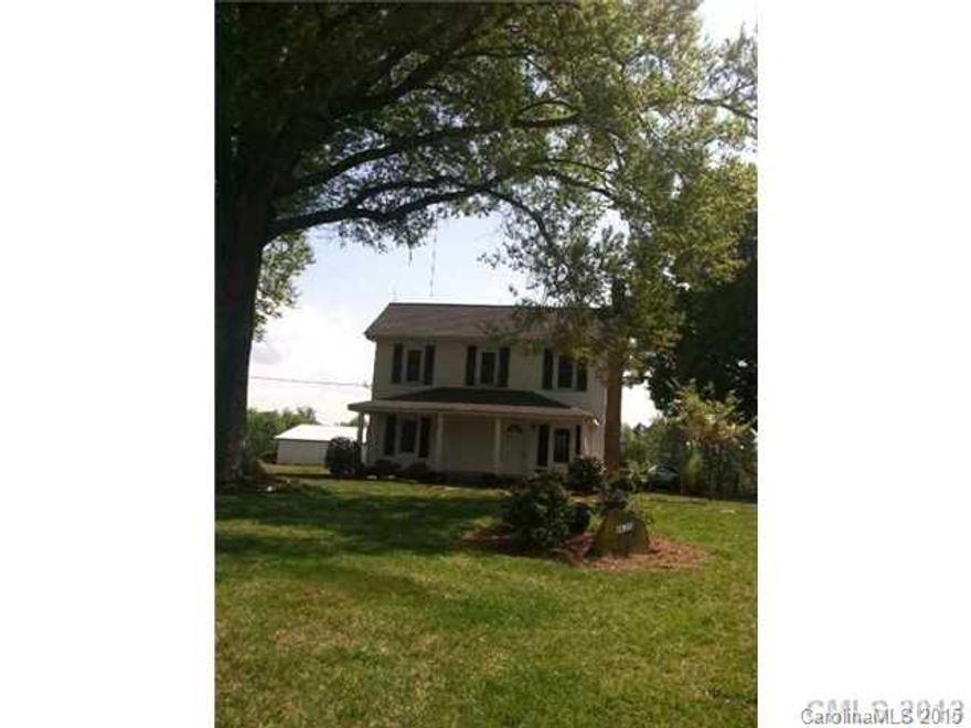 Step back in time! Charming older home on a large lot. Located at the end of a pretty street. Beautiful views! 5 minutes  to I-485! Located in Mint Hill! Bedroom downstairs and 2 more upstairs. Large kitchen with dining room.
Large Living Room! Hardwood floors! Heat Pump centrally aired and heated! New windows! Big Covered Front Porch! Large Detached Garage! Water and Sewer is included in the rent!