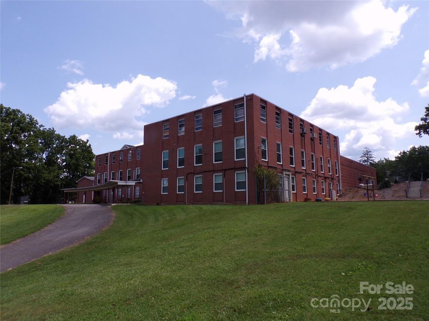 Amazing buy in WEST ASHEVILLE **Price Reduced to almost $1,000,000 UNDER TAX VALUE of $4.2, million. **Under $89 per s/f. not including the valuable 2.66 acres. The brick building has 36,000sf GBA in the heart of West Asheville. Large church just .3 miles from Haywood Rd. Has 2 sanctuaries, 6 offices, 22 classrooms or nurseries, 8 restrooms and a fellowship/dining hall with a full commercial kitchen. Paved parking lot has about 80 spaces and room for more.  2 car garage in rear. The boilers systems are newer. There is a covered breezeway for easy drop off and exiting the parking lot. This is an amazing opportunity for a charter school, non-profit, assisted living, or many other possible uses if allowed by zoning or rezoning. The church is downsizing and has been in this location for about 6 decades. A detailed floor plan is in attachments. One of the listing agents will accompany all showings.