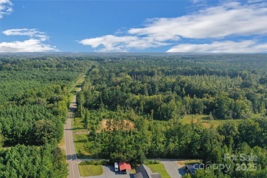 Welcome to Waxhaw’s newest community: Oak Ridge Farms; a private large-tract subdivision located in the scenic countryside of Waxhaw in Union County. This exclusive community offers 8 spacious lots ranging from 3.6 to over 20 acres, ideal for horse farms, hobby farms, or simply enjoying peace & tranquility.
 Oak Ridge Farms is located off S. Providence Road, accessed via a private gravel drive named
Oak Grove Lane.  Protective covenants and restrictions are in place to preserve the community’s character and quality, along with a road maintenance agreement for shared upkeep. Oak Ridge Farms is perfect for buyers seeking spacious land to create their dream horse farm or hobby farm providing ample room for barns, arenas, gardens, and more. Lot 7 is centrally located in the community and has 11.022 acres. The lot has a gentle grade toward a wet weather creek at the rear border.  A cleared homesite is ready for construction. This community offers the freedom to live a rural lifestyle with modern conveniences. Enjoy the privacy and charm of country living while being conveniently close to town amenities. This prime location offers easy access to Cane Creek Park, 12 Mile Creek Greenway, parks & playgrounds, farmer's markets, boutiques and local dining.