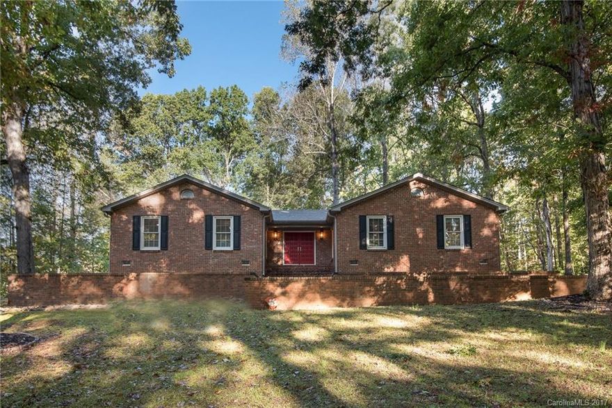 Fantastic, renovated, all brick ranch home on almost an acre lot, surrounded by mature trees! This 3 bedroom home boasts a master suite & spacious custom closet to die for! Luxury master bath has tile, his & her granite counters & seamless shower surround. Engineered hardwoods throughout entire home. Spacious floorplan allows stone fireplace to be seen from multiple rooms. Ceiling Fans in each bedroom & Family Room. "Chef's Dream" kitchen with S/S appliances, lots of cabinets & counter space.