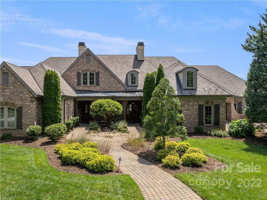 Ideal set up for a second home, primary home or live here while you build your dream home! This Luxury townhome in The Cliffs at Walnut Cove has year-round mountain views and easy access to the club tavern, golf shop, and the Jack Nicklaus Signature Golf Course! Beautiful main level living with an open, light-filled floor plan that offers coffered ceilings; stone fireplace in great room; spacious kitchen perfect for entertaining; primary suite with expansive bath and walk-in dressing room; and a second bedroom with full en suite that is currently being used as an office. Rounding out the main level is a grilling porch off the kitchen and a covered balcony off the main living area with phantom screens that overlook beautiful landscaping and mountain vistas. The lower level boasts a family room with fireplace; three additional guest rooms; a walk-out covered patio; and ample storage! Membership to The Cliffs Club is available allowing access to all seven Cliffs golf communities!