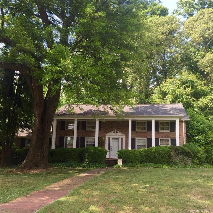 Ready to be personalized, gorgeous & classic 1960 3bdr/2ba two-story Georgian on .43 acres. This home has a beautiful entry flanked by gracious formals. Owners quarters are down along w/DR, LR w/fireplace, den w/fireplace, kitchen, & 2 car carport. Upstairs are 2 bdrs, a full bath, laundry, + bonus. Lot is private, wooded, and spacious with an amazing tree out front. Excellent location convenient to Uptown, Cotswold, Southpark, & some of Charlotte's most popular private schools. Major potential!