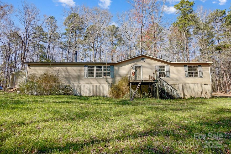 Rare chance to own a private lake accessible property that sits a little over 4 acres of land & possibly sub-dividable. This is a great opportunity for a future homeowner or investor to gain instant equity with the remodel of this home. There are extensive repairs required but with that considered there is still value in this structure considering home offers roughly 1,810 sq ft gla. Even though significant value is the land considering seclusion, private lot, & endless opportunities to build a dream home off a lake, this property also offers an opportunity to save on cost considering the existing structure versus an entire new construction build. With an open mind & end goal, you will truly see the full potential this property offers & reap the benefits. Considered & referenced price for existing structure with listing thats on 141 Patricia Street, Lancaster, SC 29720 (a manufactured home that required extensive repairs). Agent, please see agent remarks for further important details!